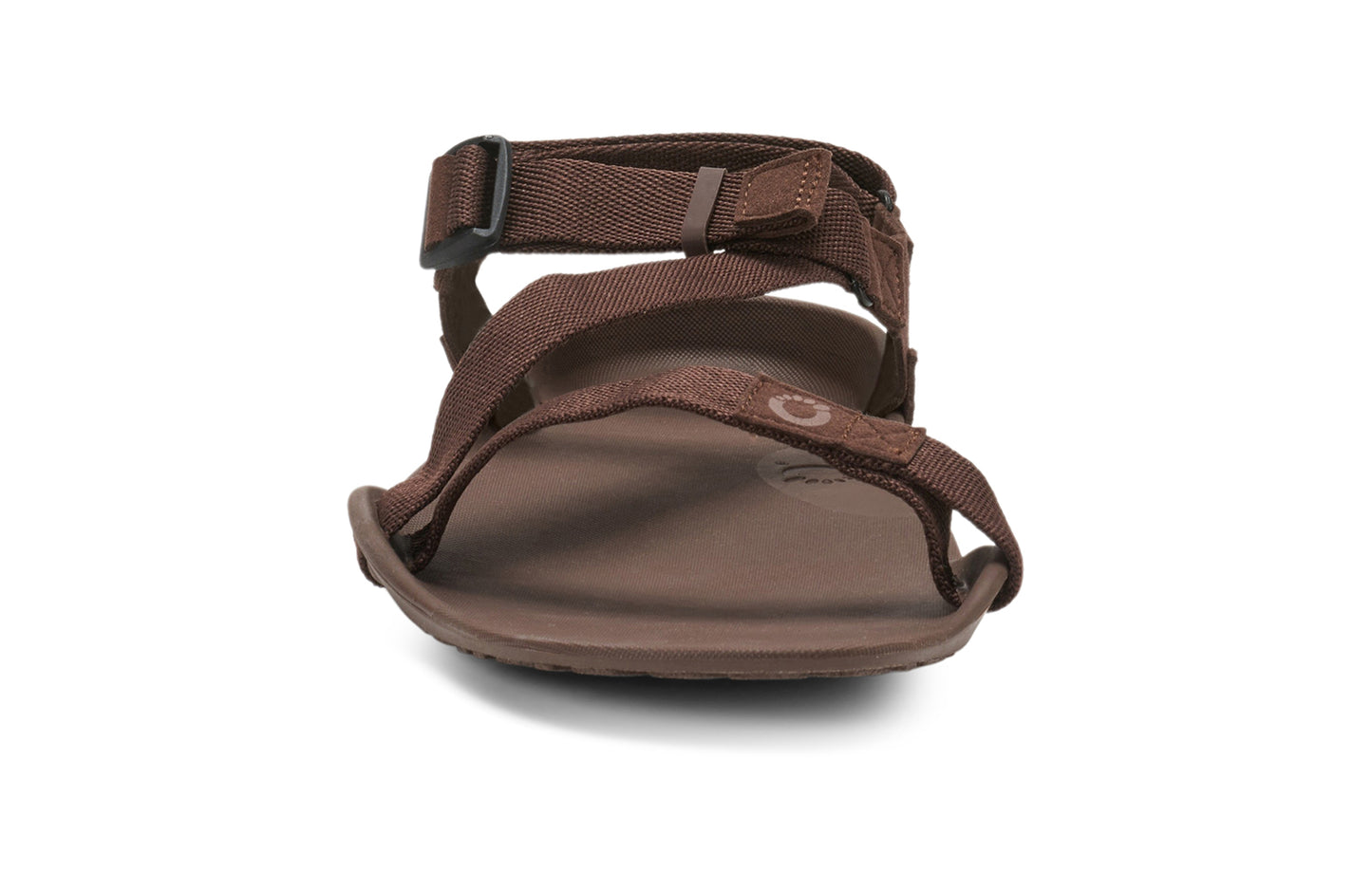 Xero Barefoot Shoes sold in Ontario, Canada. These minimalist shoes have flexible soles, wide toe boxes, and zero drop. Front view of Xero Men's Z-Trek in Brown, a lightweight packable sport sandal.