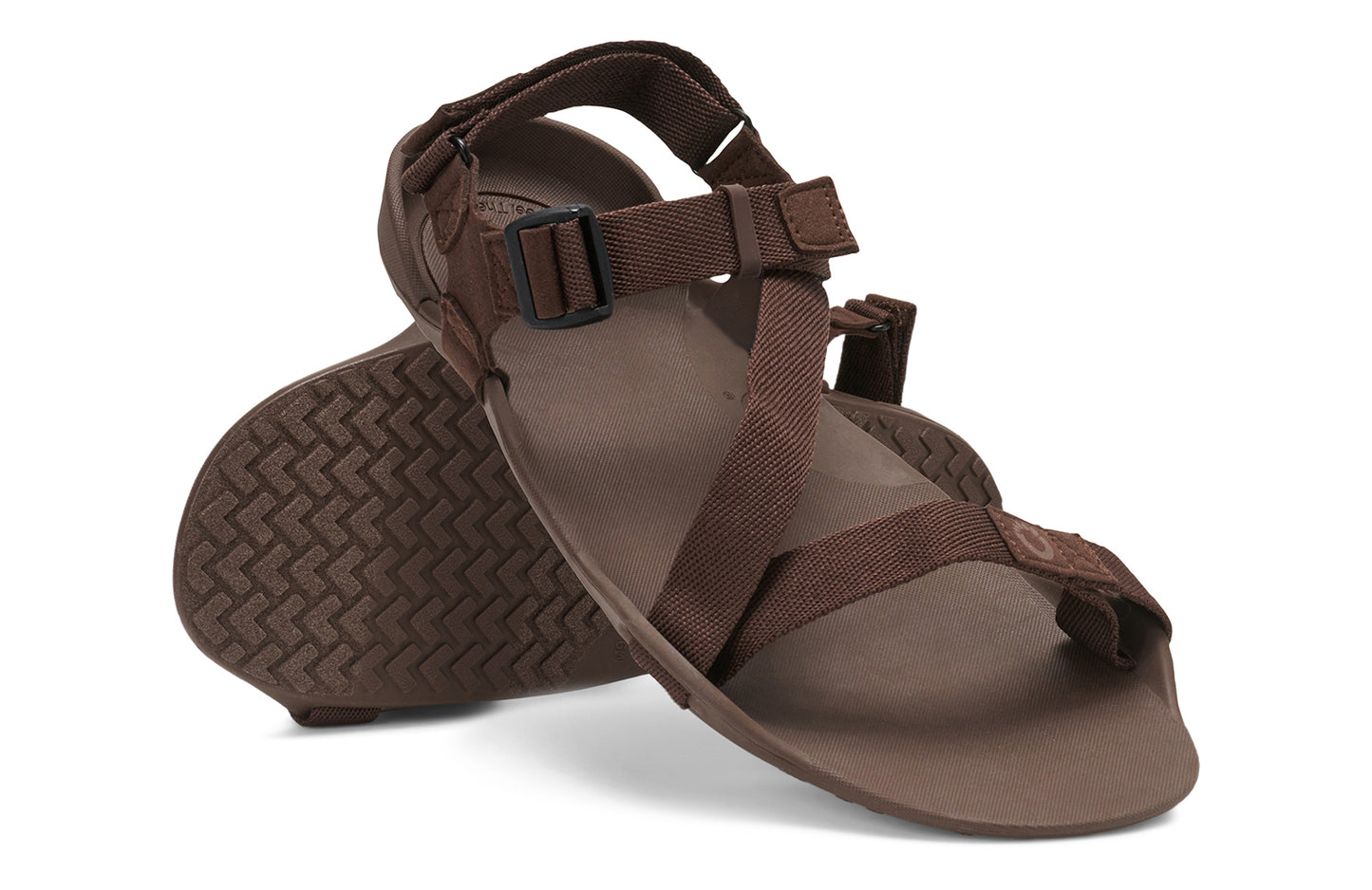 Xero Barefoot Shoes sold in Ontario, Canada. These minimalist shoes have flexible soles, wide toe boxes, and zero drop. Angled pair view of Xero Men's Z-Trek in Brown, a lightweight packable sport sandal.