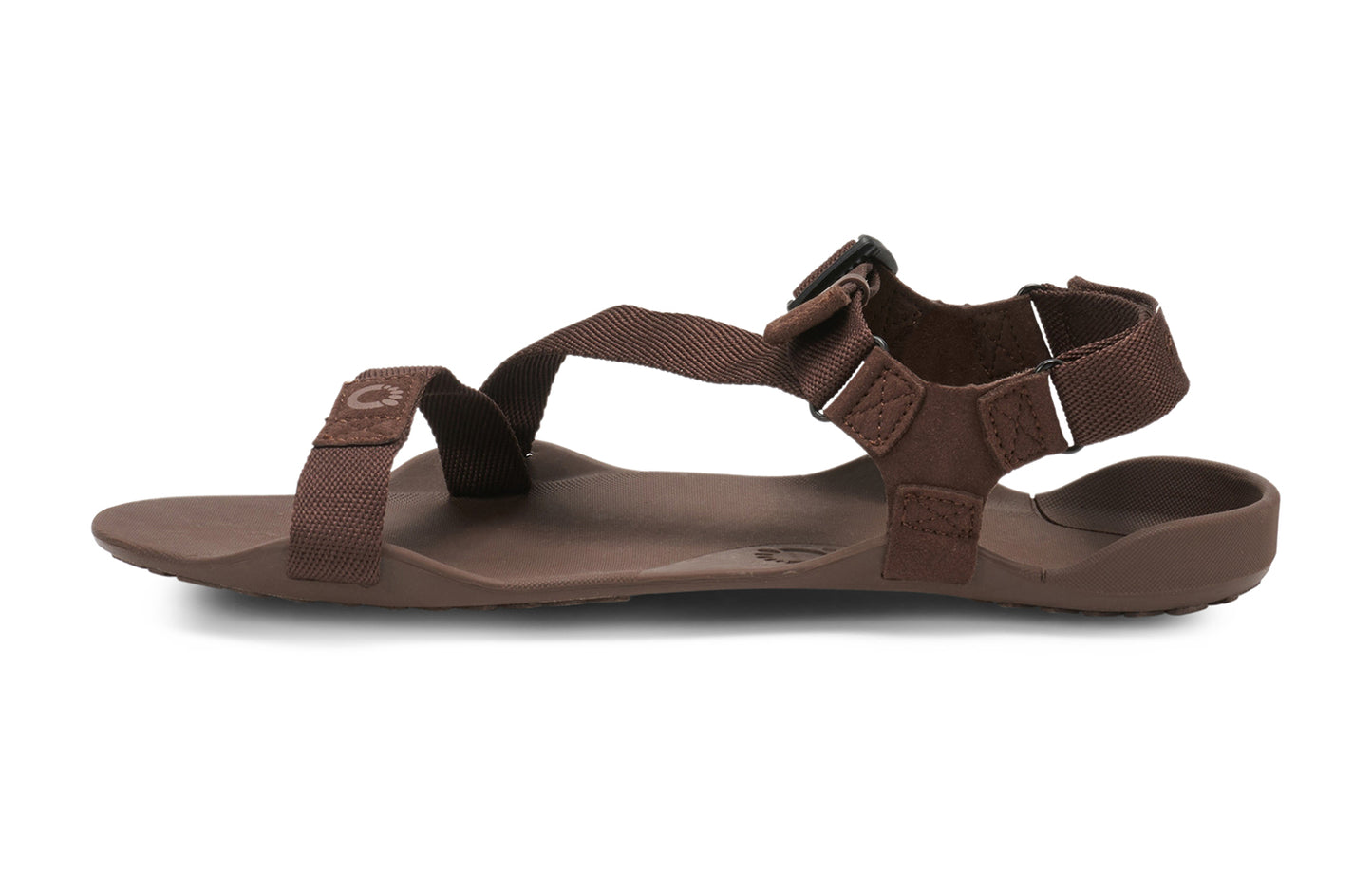 Xero Barefoot Shoes sold in Ontario, Canada. These minimalist shoes have flexible soles, wide toe boxes, and zero drop. Side view of Xero Men's Z-Trek in Brown, a lightweight packable sport sandal.