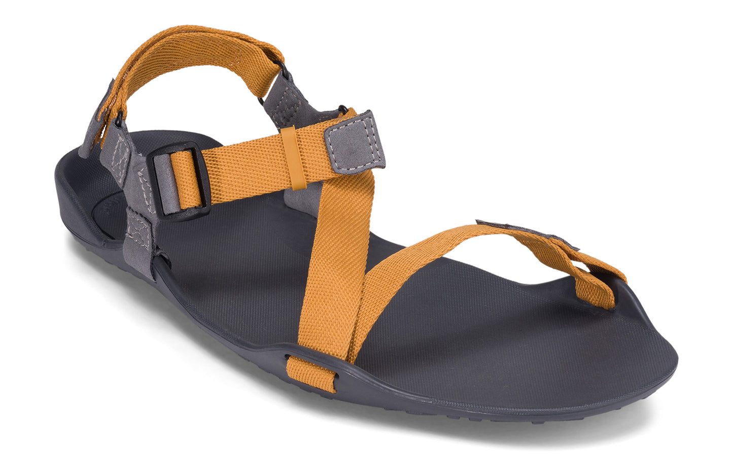 Xero Barefoot Shoes sold in Ontario, Canada. These minimalist shoes have flexible soles, wide toe boxes, and zero drop. Angled view of Xero Men's Z-Trek in Nugget, a lightweight packable sport sandal.