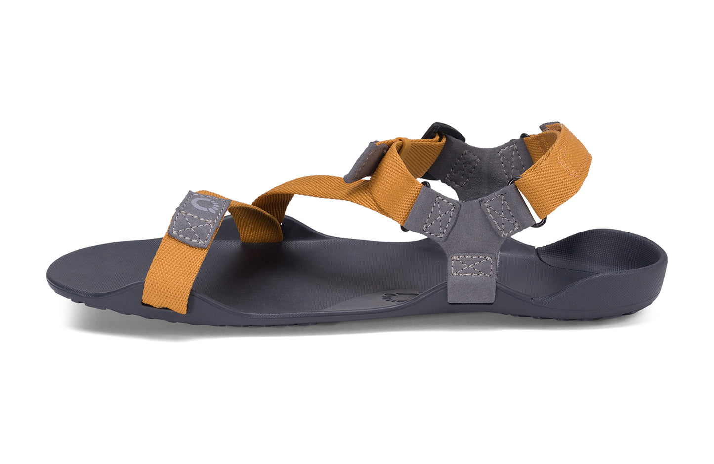 Xero Barefoot Shoes sold in Ontario, Canada. These minimalist shoes have flexible soles, wide toe boxes, and zero drop. Medial side view of Xero Men's Z-Trek in Nugget, a lightweight packable sport sandal.