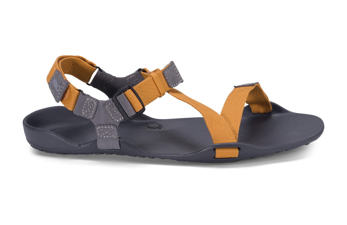 Xero Barefoot Shoes sold in Ontario, Canada. These minimalist shoes have flexible soles, wide toe boxes, and zero drop. Side view of Xero Men's Z-Trek in Nugget, a lightweight packable sport sandal.