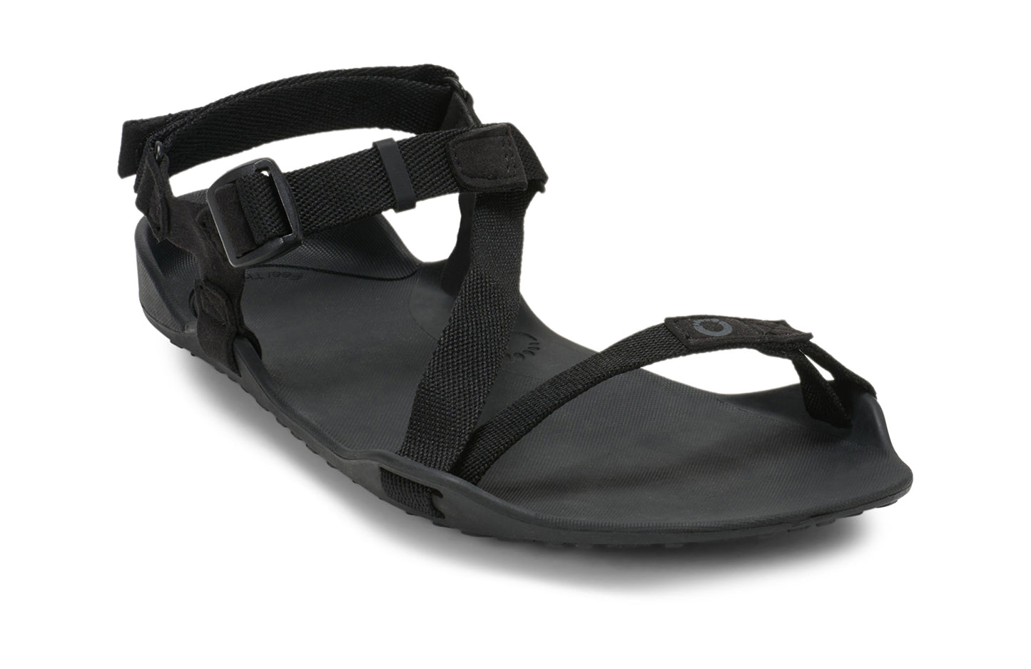Xero Barefoot Shoes sold in Ontario, Canada. These minimalist shoes have flexible soles, wide toe boxes, and zero drop. Angled view of Xero Women's Z-Trek in Black, a lightweight packable sport sandal.