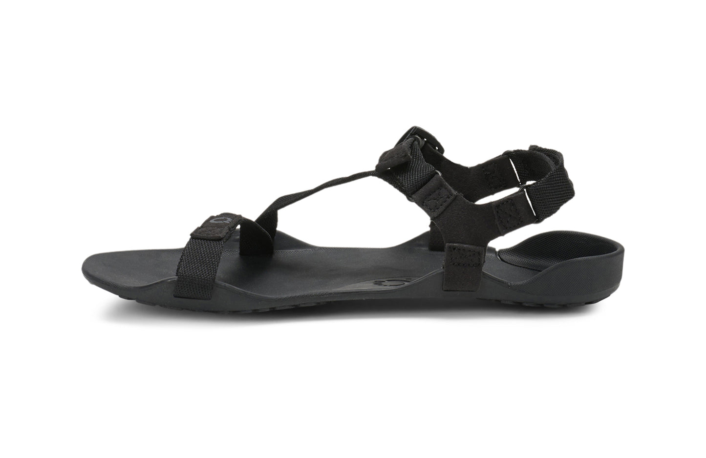 Xero Barefoot Shoes sold in Ontario, Canada. These minimalist shoes have flexible soles, wide toe boxes, and zero drop. Side view of Xero Women's Z-Trek in Black, a lightweight packable sport sandal.