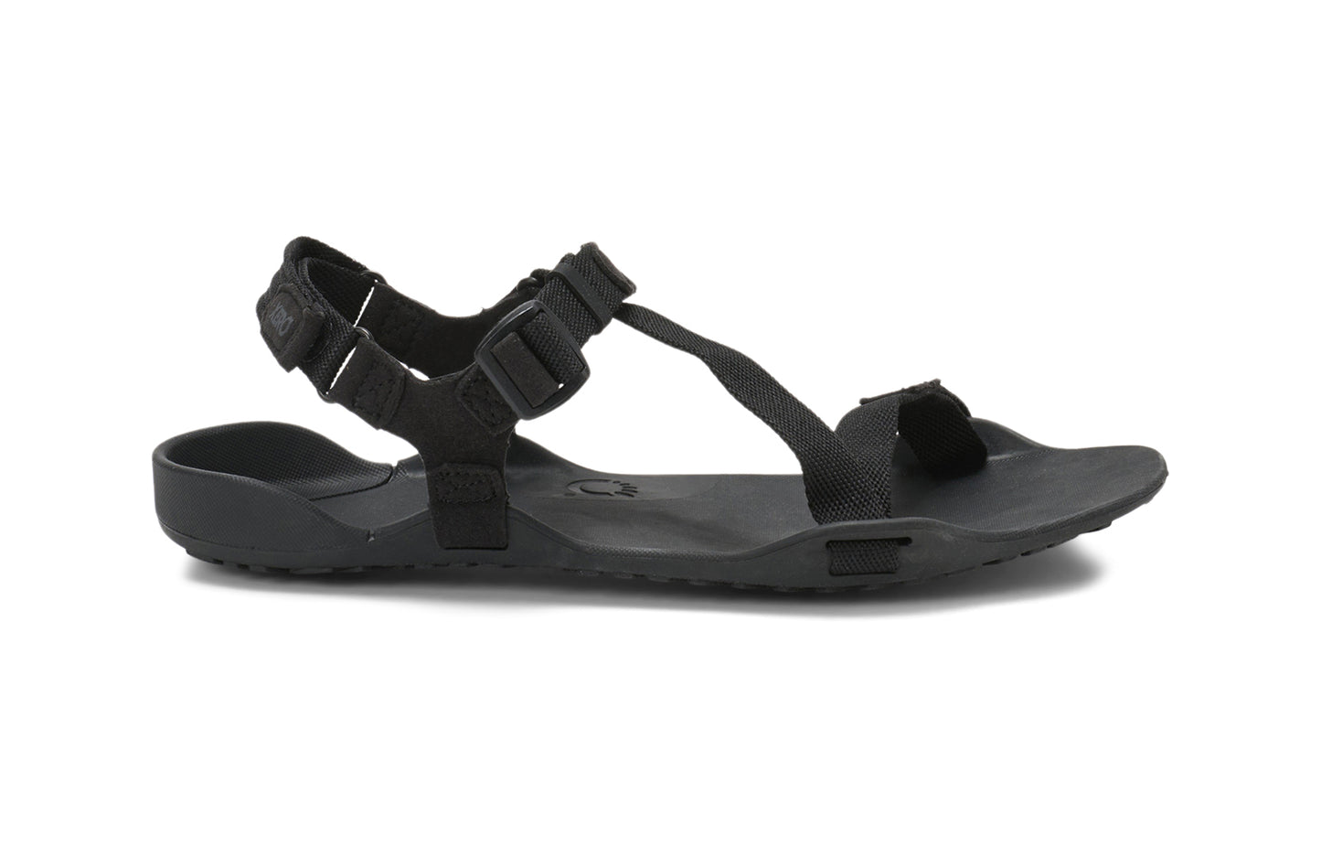 Xero Barefoot Shoes sold in Ontario, Canada. These minimalist shoes have flexible soles, wide toe boxes, and zero drop. Side view of Xero Women's Z-Trek in Black, a lightweight packable sport sandal.