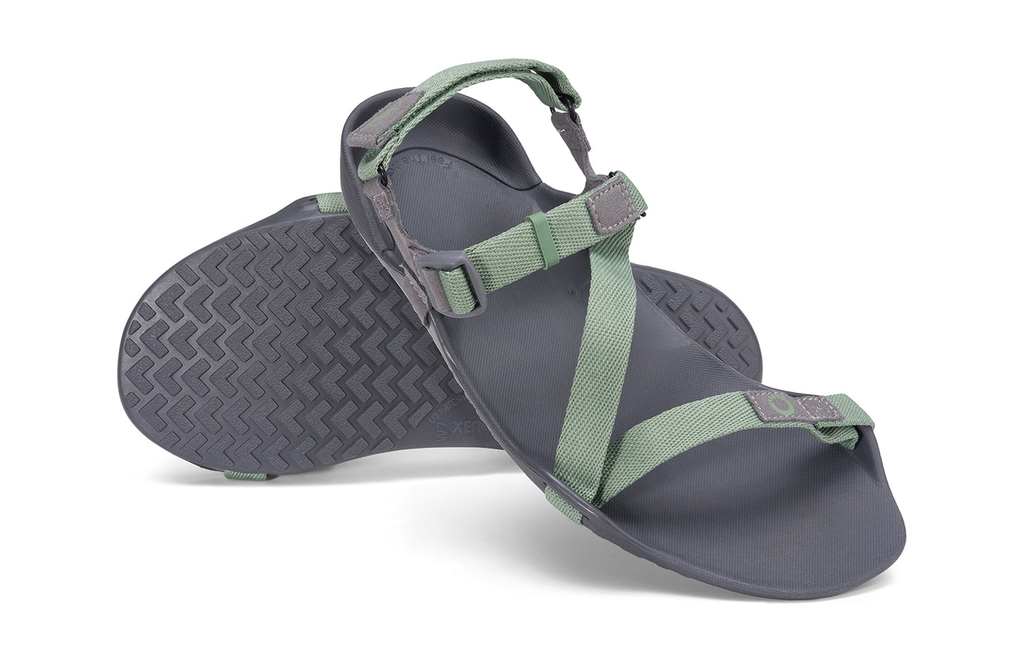 Xero Barefoot Shoes sold in Ontario, Canada. These minimalist shoes have flexible soles, wide toe boxes, and zero drop. Angled pair view of Xero Women's Z-Trek in Green, a lightweight packable sport sandal.