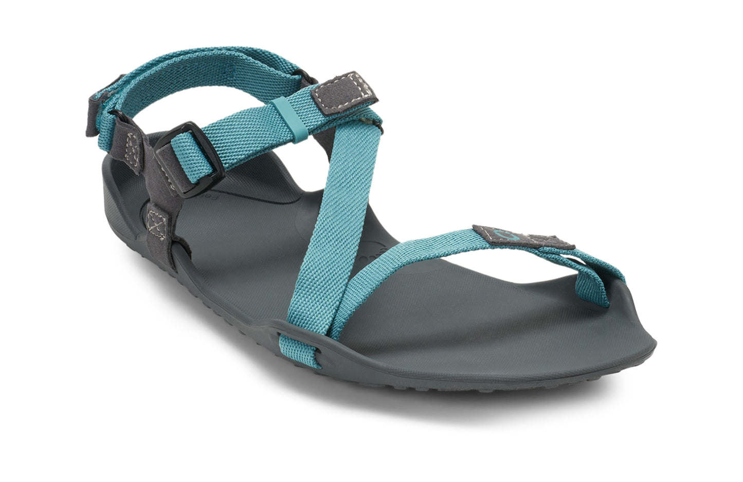 Xero Barefoot Shoes sold in Ontario, Canada. These minimalist shoes have flexible soles, wide toe boxes, and zero drop. Angled view of Xero Women's Z-Trek in Porcelain, a lightweight packable sport sandal.