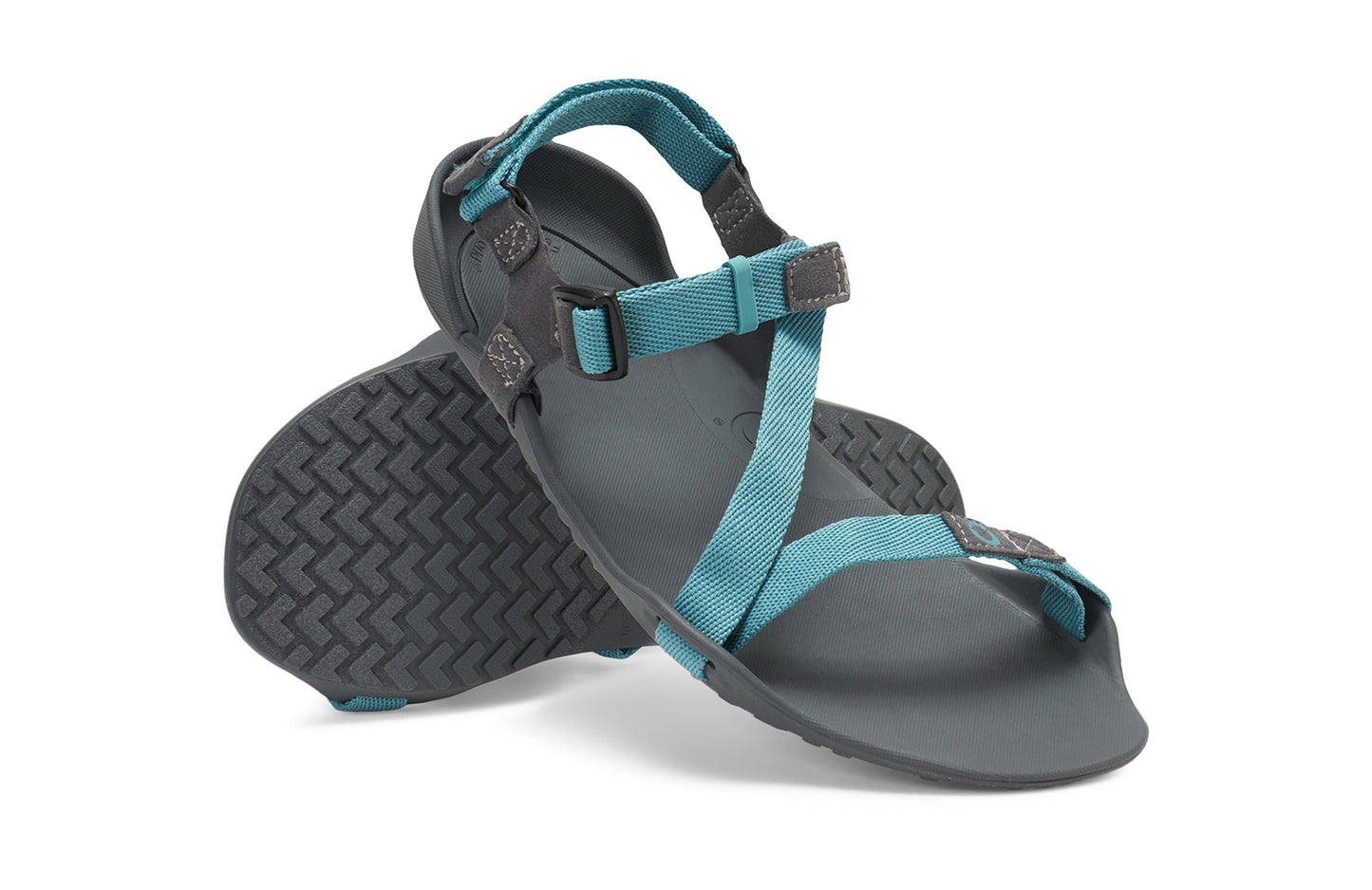 Xero Barefoot Shoes sold in Ontario, Canada. These minimalist shoes have flexible soles, wide toe boxes, and zero drop. Angled pair view of Xero Women's Z-Trek in Porcelain, a lightweight packable sport sandal.
