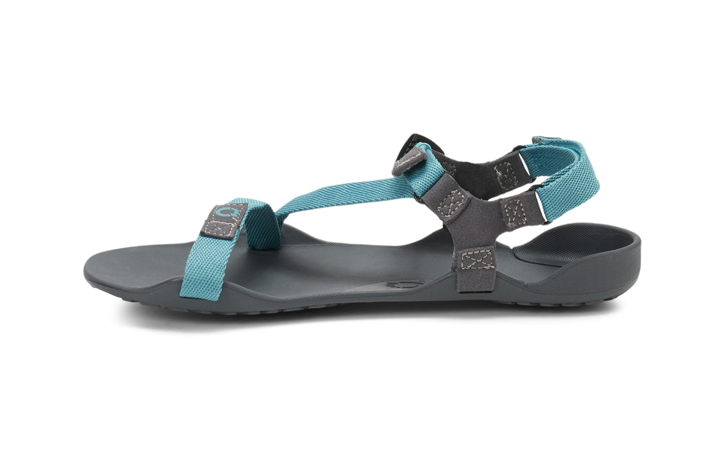 Xero Barefoot Shoes sold in Ontario, Canada. These minimalist shoes have flexible soles, wide toe boxes, and zero drop. Side view of Xero Women's Z-Trek in Porcelain, a lightweight packable sport sandal.