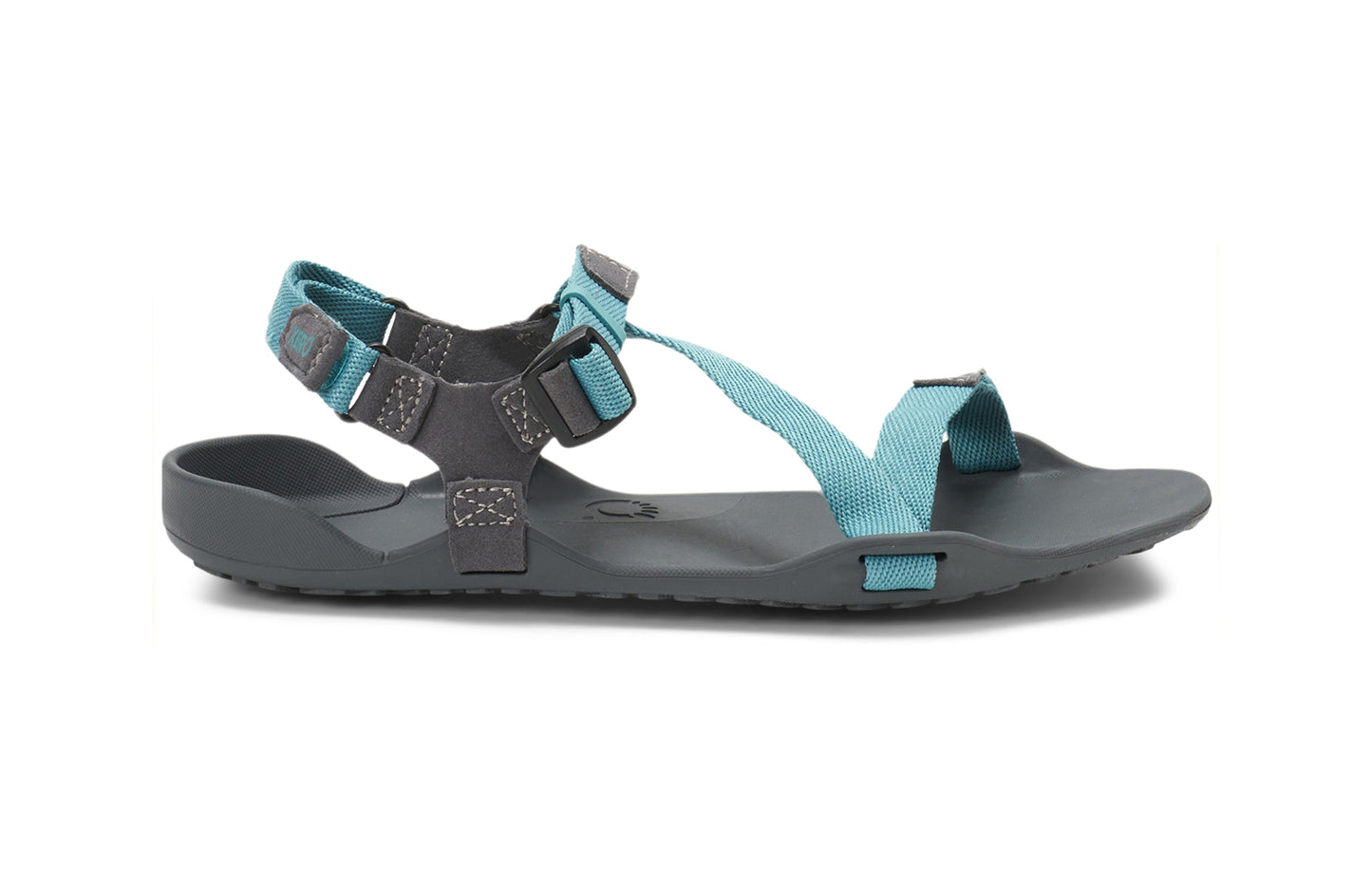 Xero Barefoot Shoes sold in Ontario, Canada. These minimalist shoes have flexible soles, wide toe boxes, and zero drop. Lateral side view of Xero Women's Z-Trek in Porcelain, a lightweight packable sport sandal.