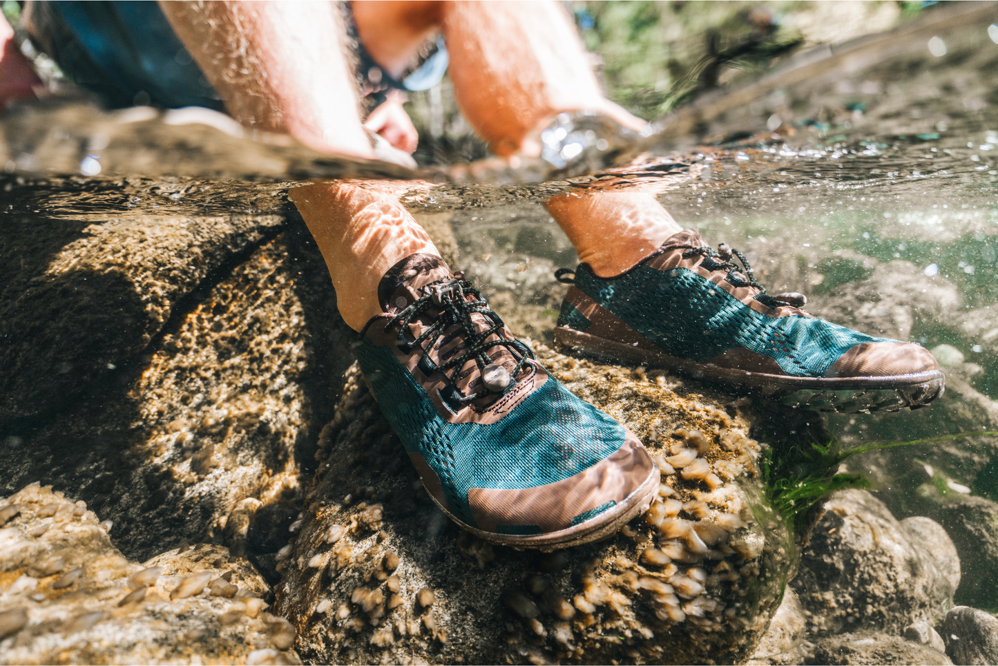 Xero Shoes Canada, man wearing Aqua X Sport in rocky water