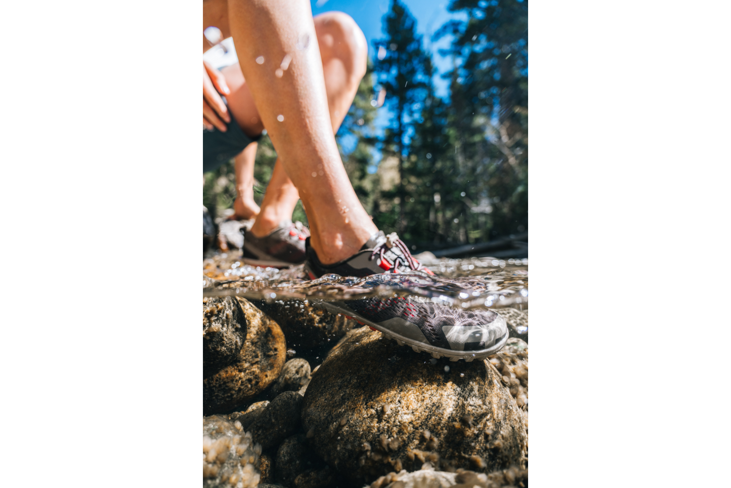 Xero Shoes Canada aqua x sport, woman dipping shoes in rocky water