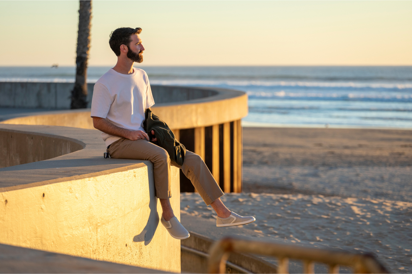Xero Shoes Canada, specifically men’s barefoot shoes Canada, man wearing Dillon Canvas Slip Ons at a beach