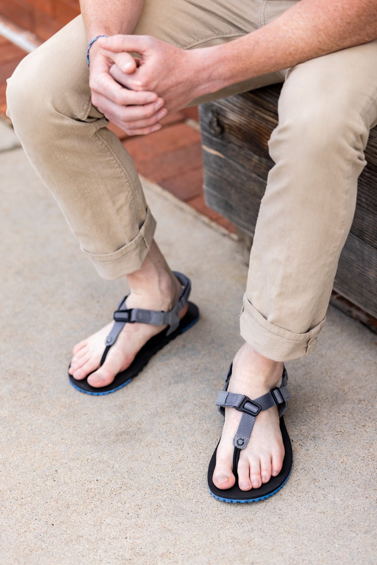 Xero Shoes Canada, specifically men’s barefoot shoes Canada. Man wearing H-Trail sandals with pants