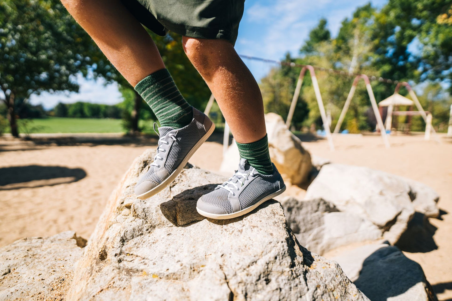 Xero shoes Canada, barefoot shoes for kids. Kid wearing Dillons on playground.