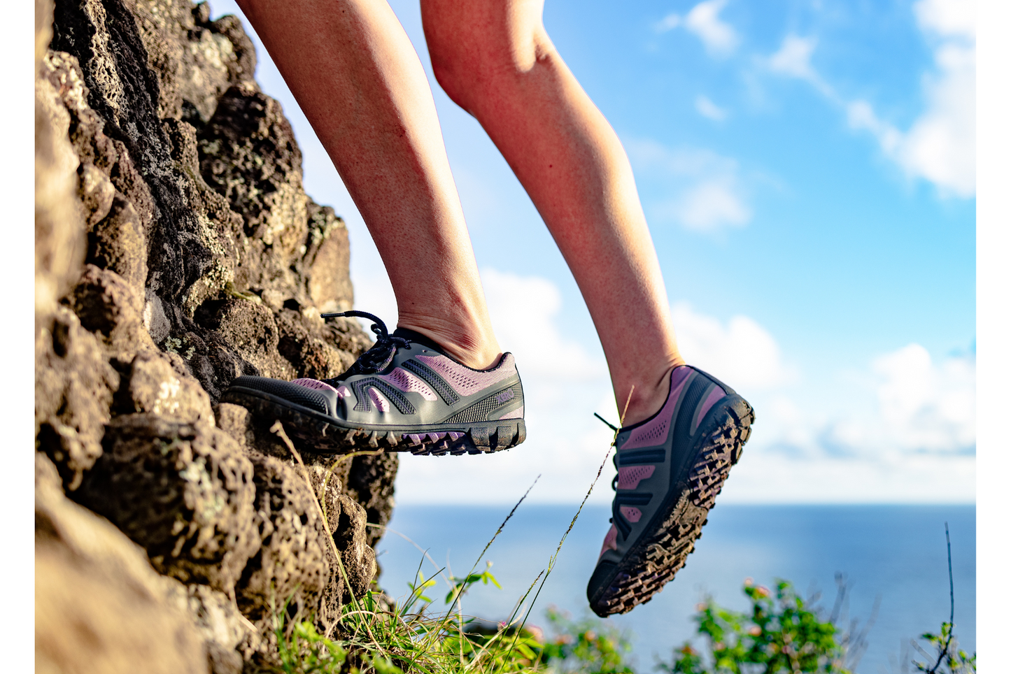 Xero Shoes Canada, specifically barefoot hiking shoes Canada. Woman wearing Mesa Trail II while climbing a rock