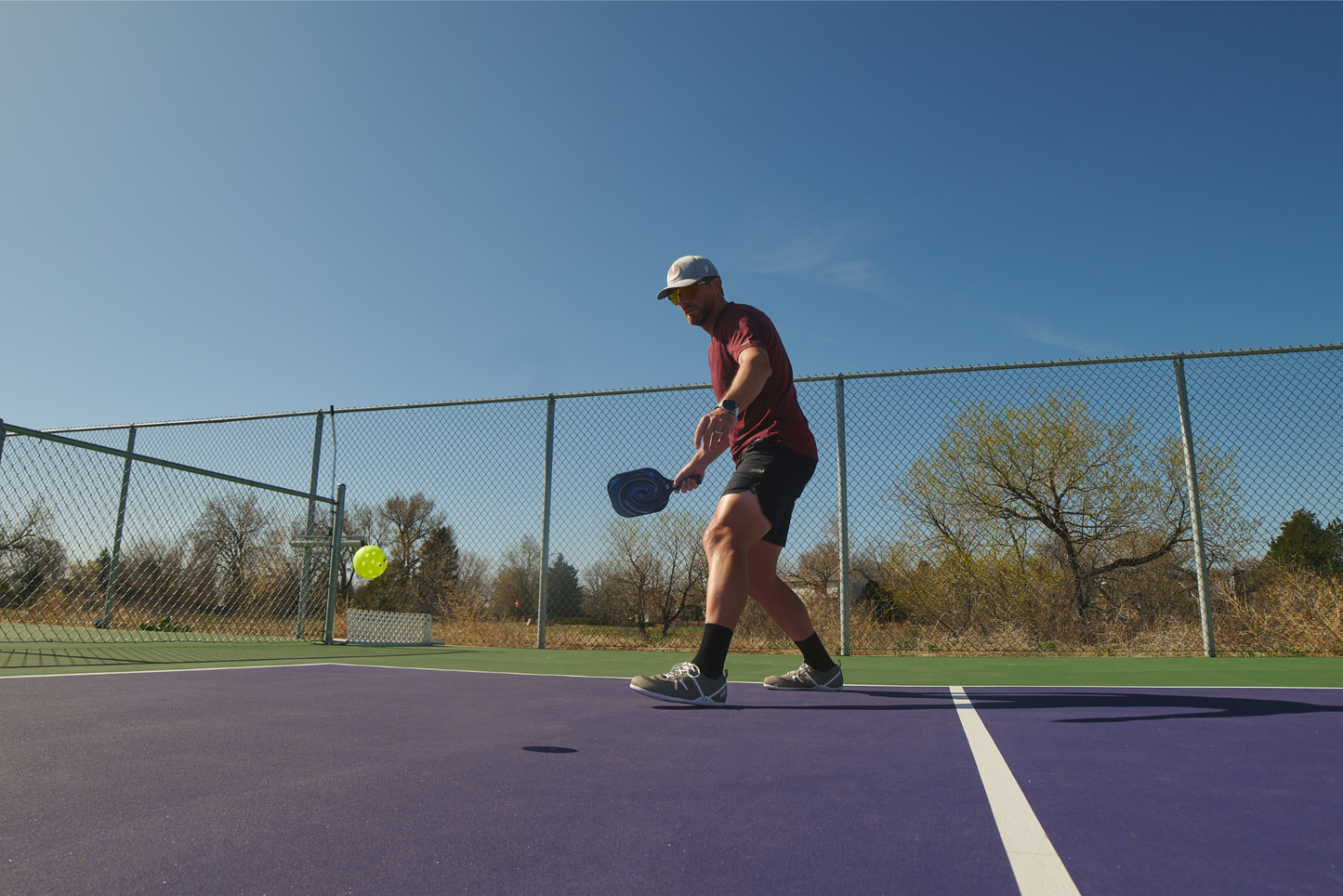 Xero Shoes Canada, specifically men’s barefoot shoes Canada. Man wearing Prio while playing pickleball.