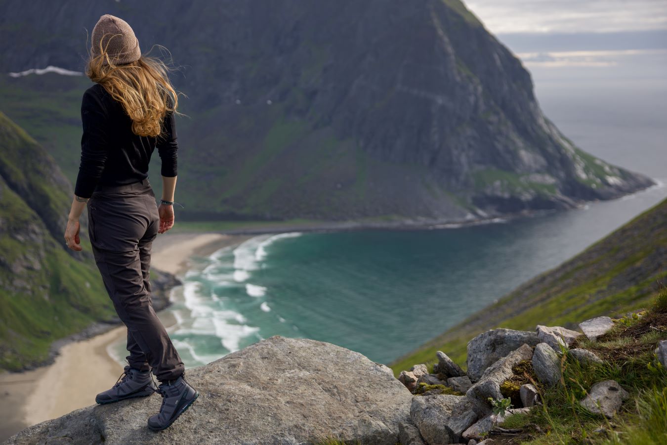 Xero Shoes Canada, specifically barefoot hiking shoes Canada. Woman wearing Scrambler Mid while at the top of a cliff