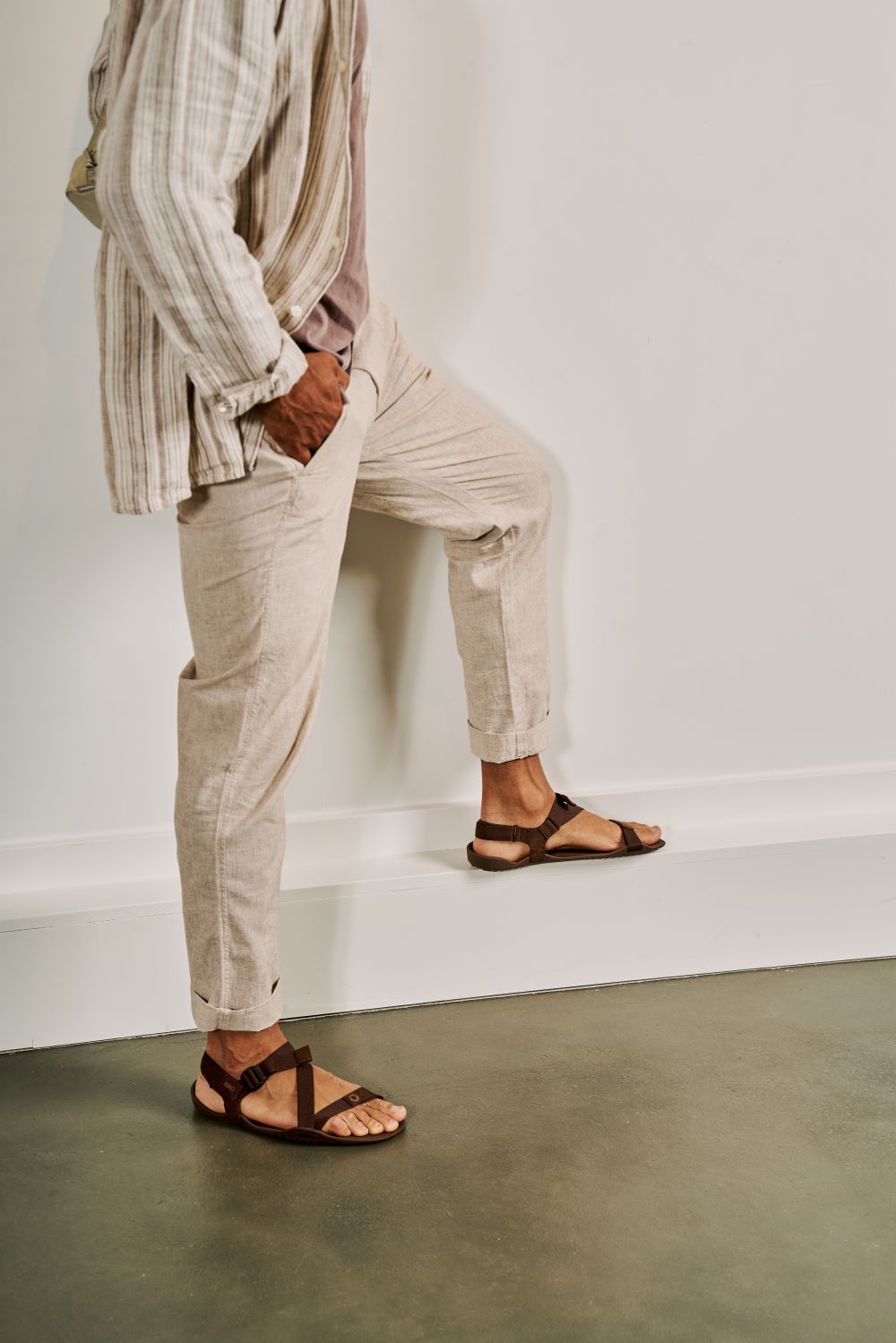 Xero Shoes Canada, specifically men’s barefoot shoes Canada. Man wearing Z-Trek with white pants