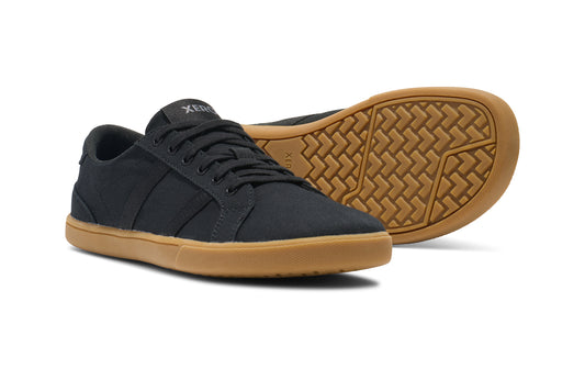 Xero Shoes Canada, specifically men’s barefoot shoes Canada. These minimalist shoes have flexible soles, wide toe boxes, and zero drop. Pair view of Xero Men's Dillon Canvas in Black Gum, a classic sneaker.
