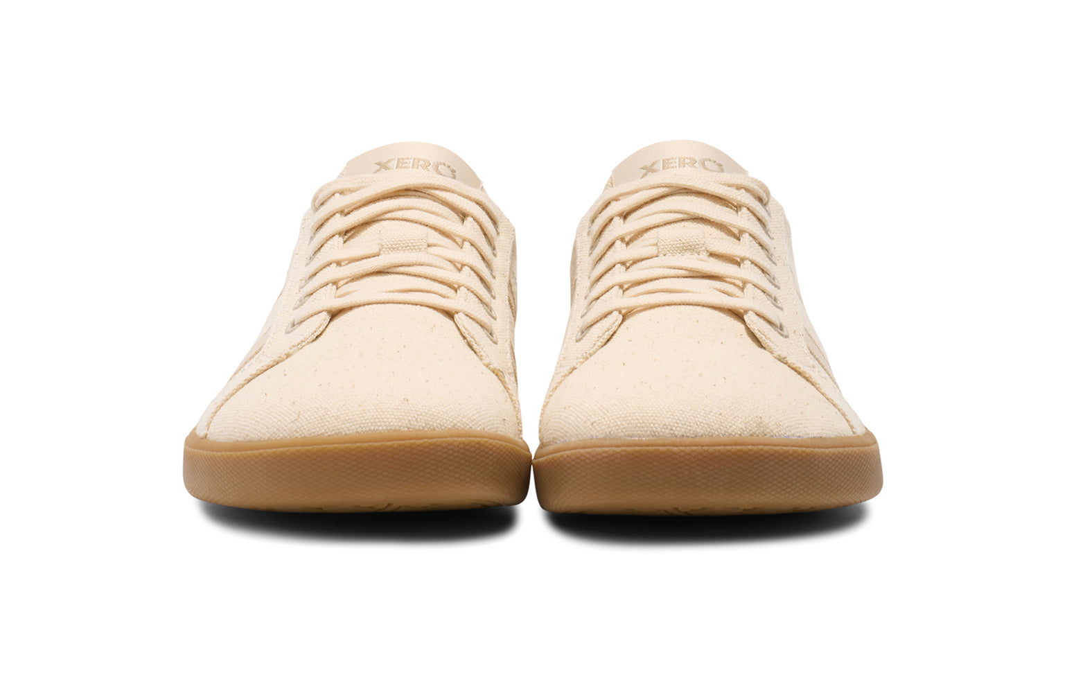 Xero Shoes Canada, specifically men’s barefoot shoes Canada. These minimalist shoes have flexible soles, wide toe boxes, and zero drop. Front view of Xero Men's Dillon Canvas in Natural Gum, a classic sneaker.