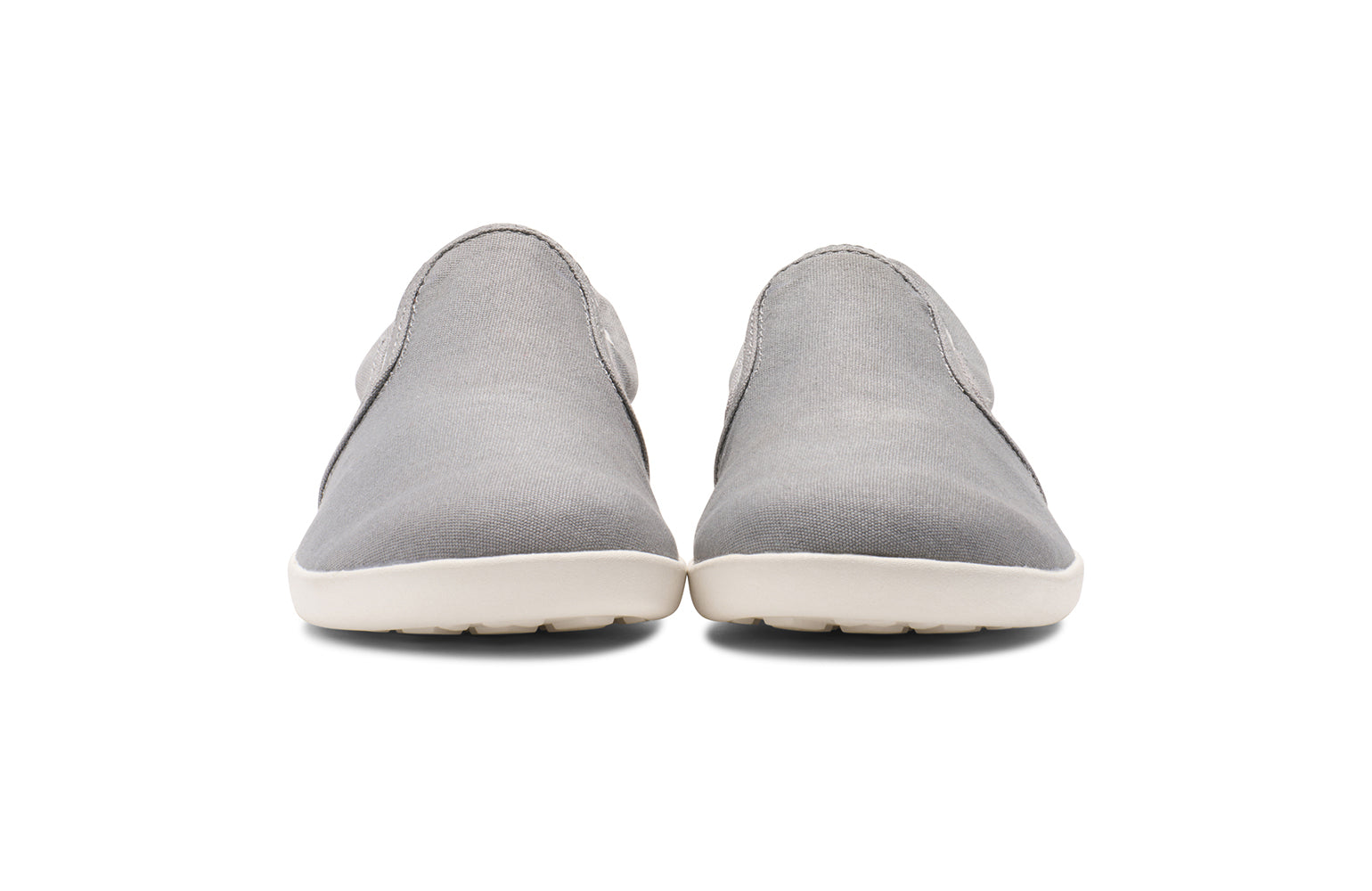 Xero Kid's Barefoot Shoes sold in Ontario, Canada. These minimalist shoes have flexible soles, wide toe boxes, and zero drop. Front view of Xero Youth Dillon Canvas Slip-On in Alloy. 