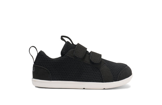 Xero Barefoot shoes for kids sold in Ontario, Canada. These minimalist shoes have flexible soles, wide toe boxes, and zero drop. Side view of Xero Dillon Little Kids in Black, a classic sneaker.