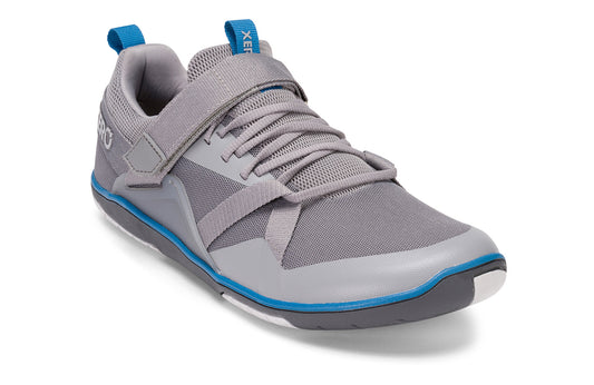 Xero Shoes Canada, specifically barefoot running shoes Canada. These minimalist shoes have flexible soles, wide toe boxes, and zero drop. Angled view of Xero Men's Forza Trainer in Frost Gray. A stable training shoe.