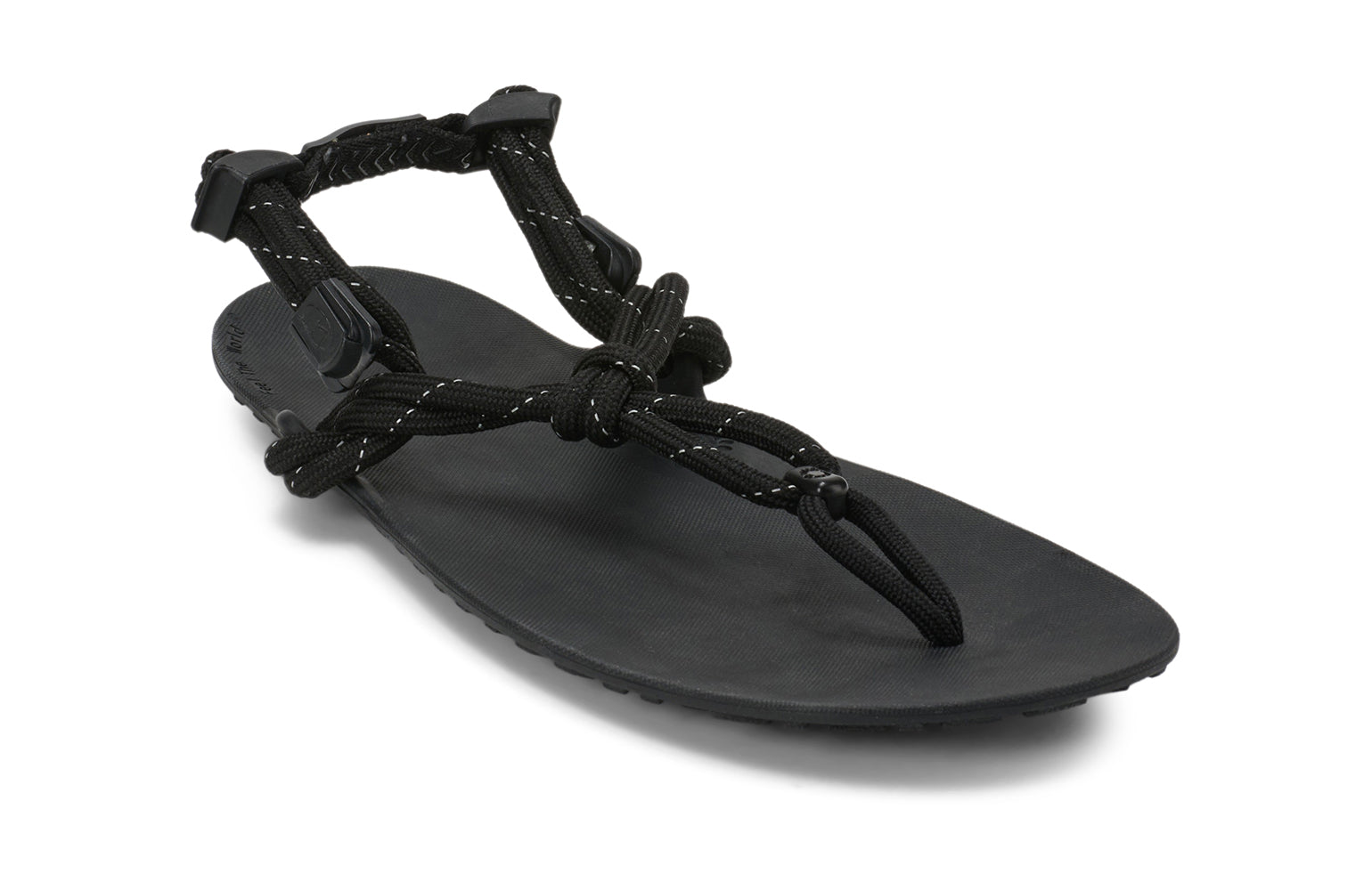 Xero Shoes Canada, specifically men’s barefoot shoes Canada. These minimalist shoes have flexible soles, wide toe boxes, and zero drop. Angled view of Xero Men's Genesis in Black. Lightweight, packable, travel-friendly sandal.  
