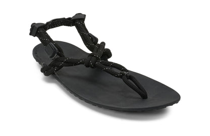Xero Shoes Canada, specifically men’s barefoot shoes Canada. These minimalist shoes have flexible soles, wide toe boxes, and zero drop. Angled view of Xero Men's Genesis in Black. Lightweight, packable, travel-friendly sandal.  