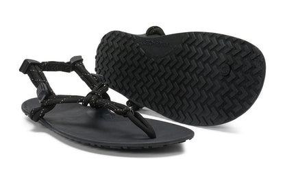 Xero Shoes Canada, specifically women’s barefoot shoes Canada. These minimalist shoes have flexible soles, wide toe boxes, and zero drop. Pair view of Xero Women's Genesis in Black. Lightweight, packable, travel-friendly sandal.  