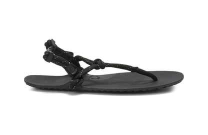 Xero Shoes Canada, specifically women’s barefoot shoes Canada. These minimalist shoes have flexible soles, wide toe boxes, and zero drop. Lateral side view of Xero Women's Genesis in Black. Lightweight, packable, travel-friendly sandal.  