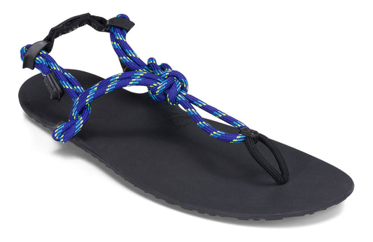 Xero Shoes Canada, specifically men’s barefoot shoes Canada. These minimalist shoes have flexible soles, wide toe boxes, and zero drop. Angled view of Xero Men's Genesis in Sodalite Blue. Lightweight, packable, travel-friendly sandal.  