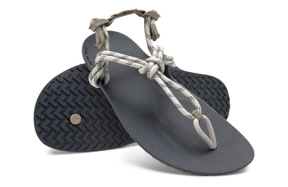 Xero Shoes Canada, specifically men’s barefoot shoes Canada. These minimalist shoes have flexible soles, wide toe boxes, and zero drop. Angled pair view of Xero Men's Genesis in Stone. Lightweight, packable, travel-friendly sandal.  