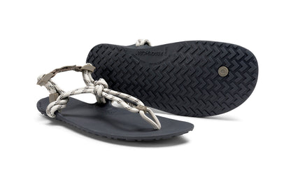 Xero Shoes Canada, specifically women’s barefoot shoes Canada. These minimalist shoes have flexible soles, wide toe boxes, and zero drop. Pair view of Xero Women's Genesis in Stone. Lightweight, packable, travel-friendly sandal.  