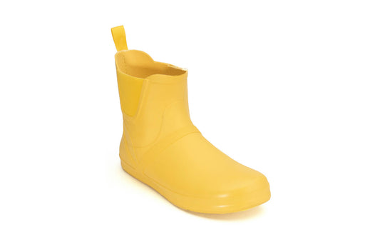 Xero Shoes Canada, specifically women’s barefoot shoes Canada. These minimalist shoes have flexible soles, wide toe boxes, and zero drop. Angled view of Xero Women's Gracie in Yellow. Fun and comfy rain boot. 