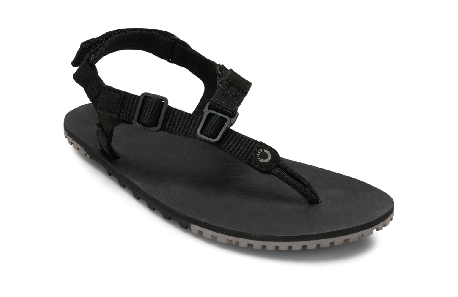Xero Shoes Canada, specifically men’s barefoot shoes Canada. These minimalist shoes have flexible soles, wide toe boxes, and zero drop. Angled view of Men's H-Trail in Black. A huarache-style hiking sandal.