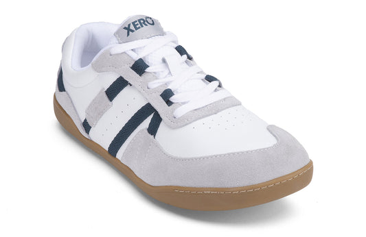 Xero Shoes Canada, specifically women’s barefoot shoes Canada. These minimalist shoes have flexible soles, wide toe boxes, and zero drop. Angled view of Xero Women's Kelso in White. Leather and suede court-style shoe. 