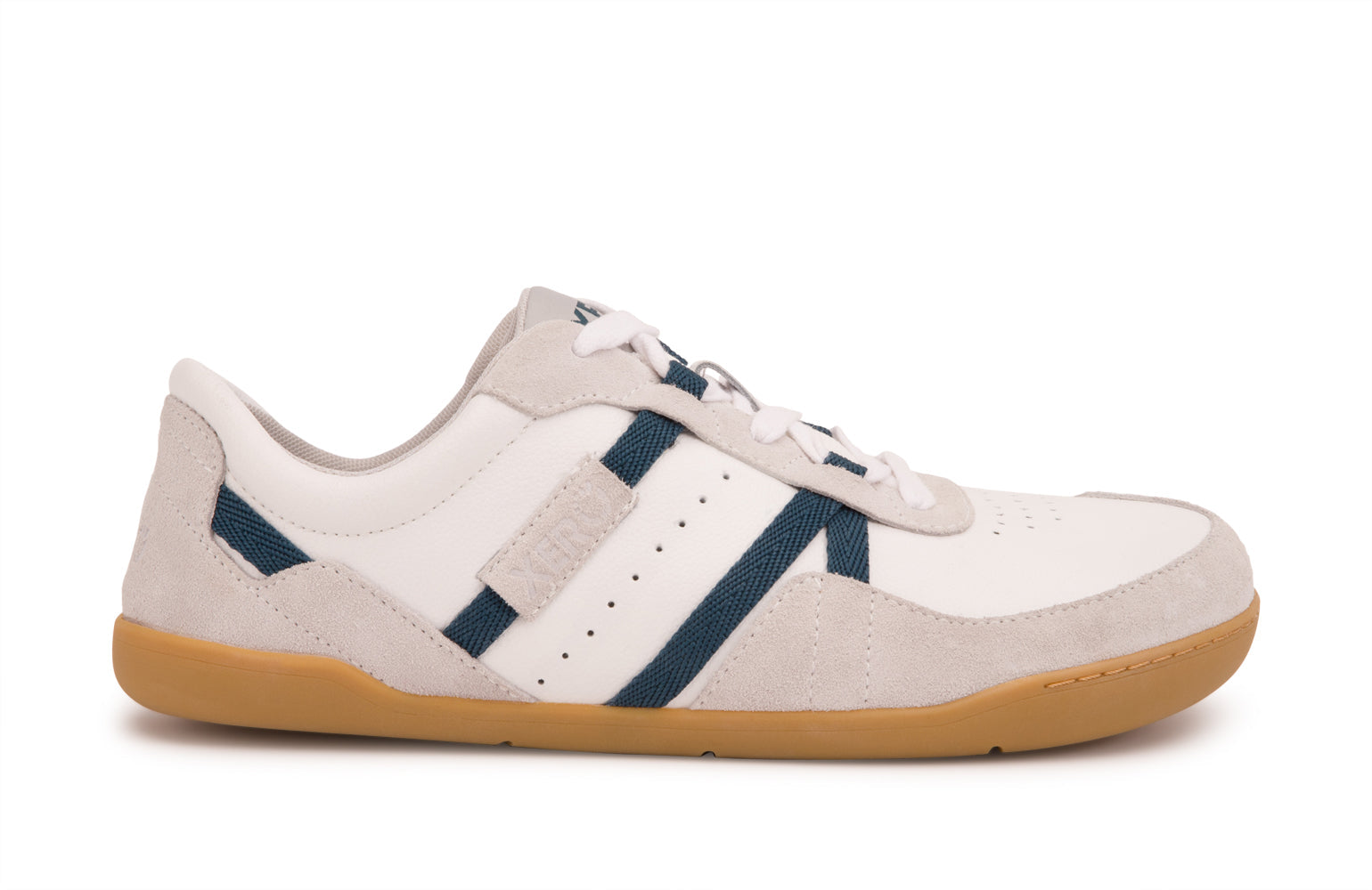 Xero Shoes Canada, specifically men’s barefoot shoes Canada. These minimalist shoes have flexible soles, wide toe boxes, and zero drop. Lateral side view of Xero Men's Kelso in White. Leather and suede court-style shoe. 