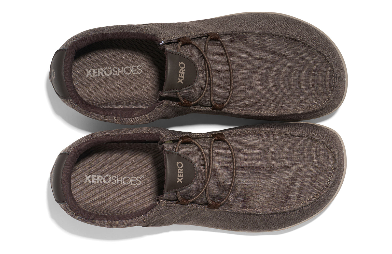 Xero Shoes Canada, specifically men’s barefoot shoes Canada. These minimalist shoes have flexible soles, wide toe boxes, and zero drop. Top pair view of Xero Men's Kona in Morel. Moccasin inspired casual shoe. 