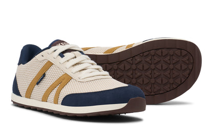 Pair of sneakers with white, blue, and brown color scheme on a white background. Tru Stride Co brings Xero Shoes to Canada