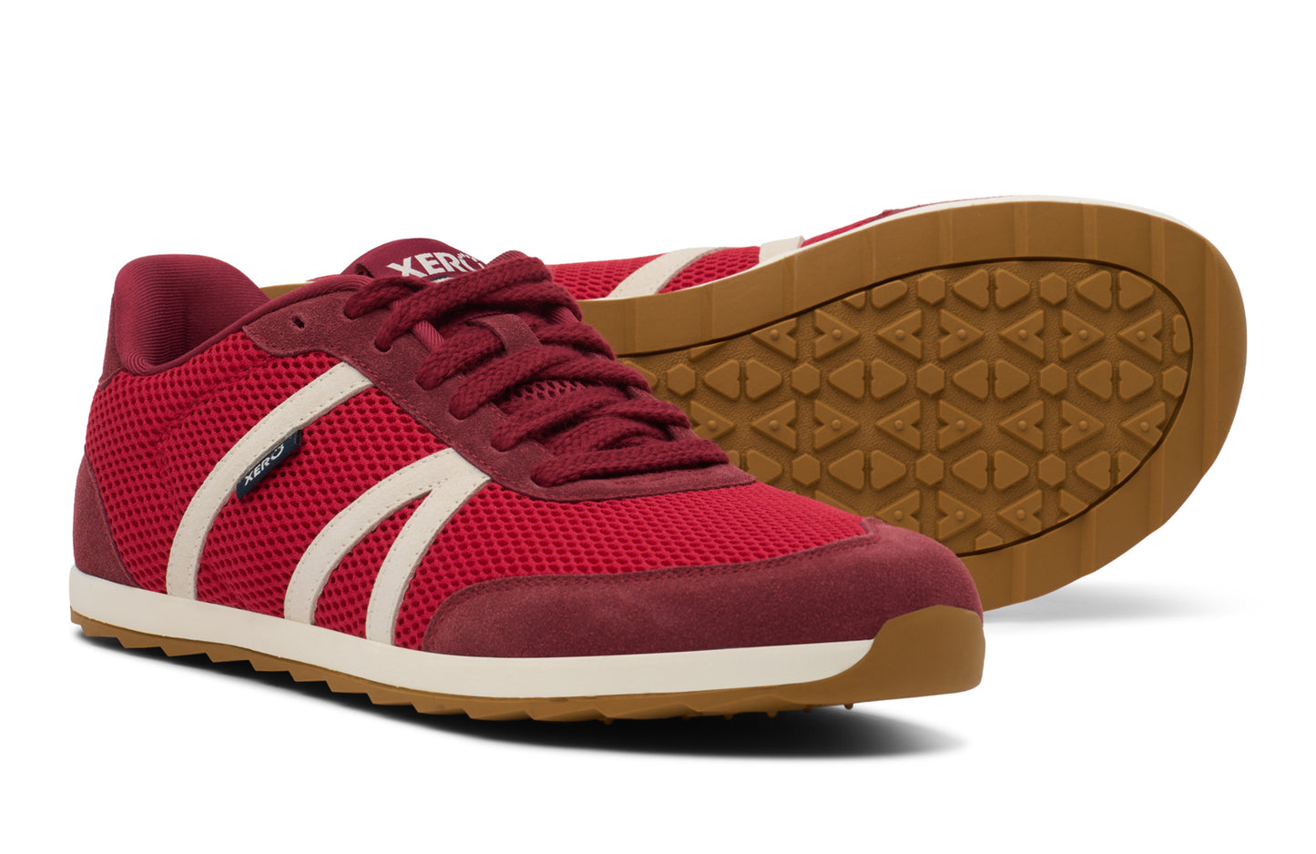 Red sneakers with white accents on a white background. Tru Stride Co brings Xero Shoes to Canada