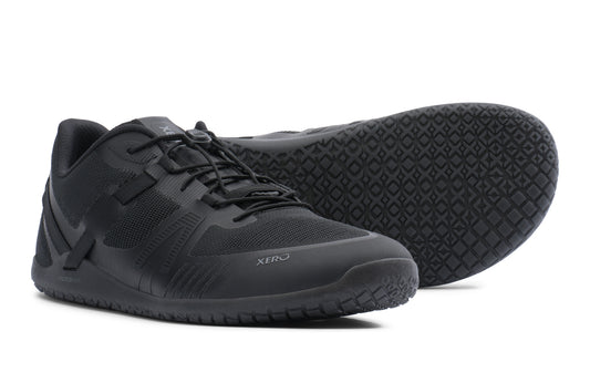 Black athletic shoes with textured sole on a white background. Tru Stride Co brings Xero Shoes to Canada