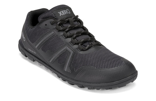 Xero Shoes Canada, specifically barefoot hiking shoes Canada. These minimalist shoes have flexible soles, wide toe boxes, and zero drop. Angled view of Xero Women's Mesa Trail II in Black. Durable, waterproof hiking shoe. 