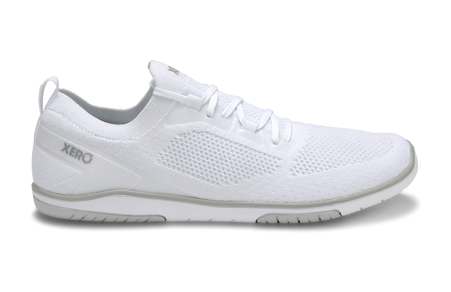 Xero Shoes Canada, specifically barefoot running shoes Canada. These minimalist shoes have flexible soles, wide toe boxes, and zero drop. Side lateral view of Xero Men's Nexus Knit in White. An athletic, comfortable shoe.