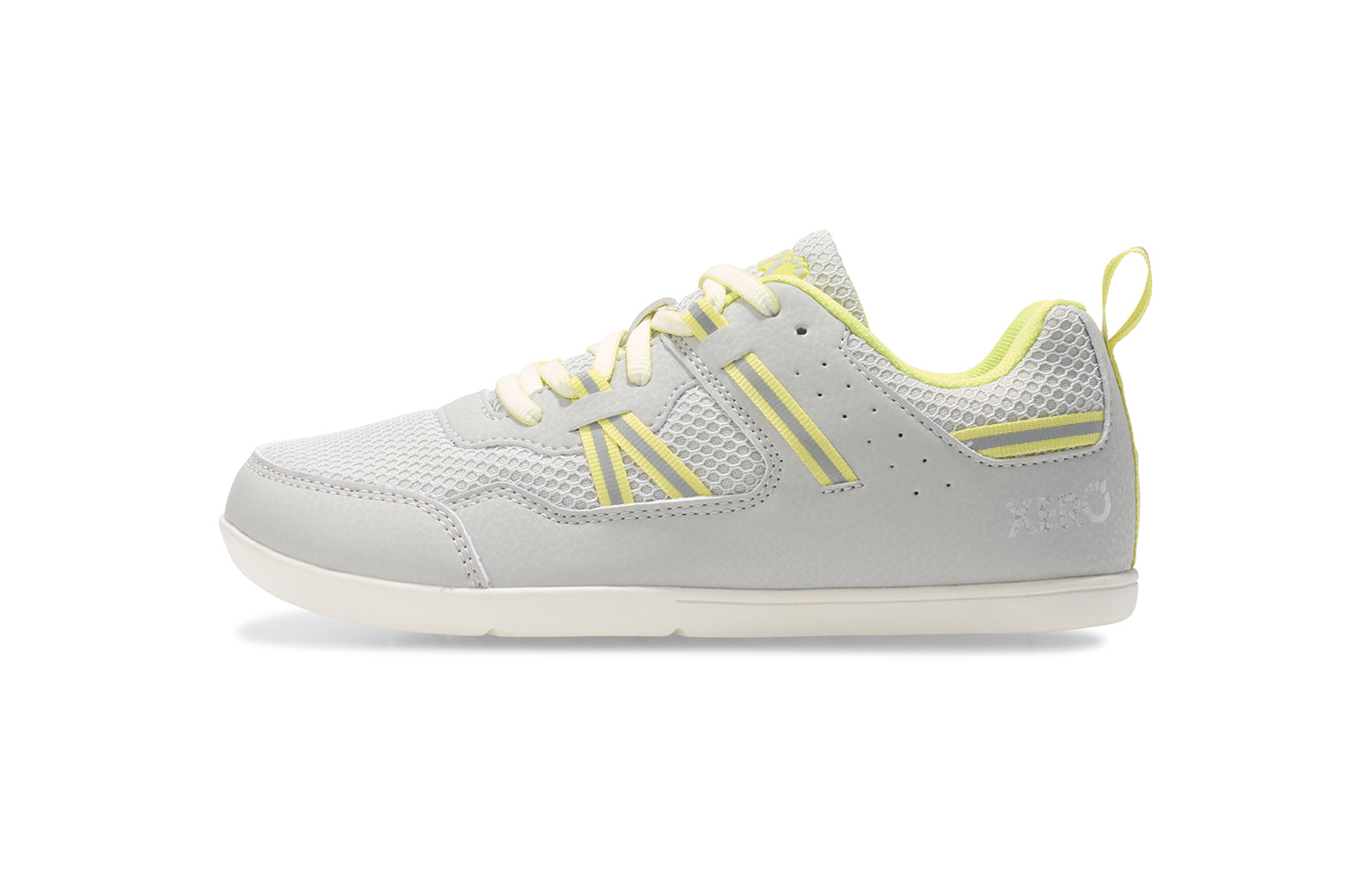 Xero Barefoot Shoes for kids sold in Ontario, Canada. These minimalist shoes have flexible soles, wide toe boxes, and zero drop. Medial side view of Xero Kid's Prio in Lunar Rock/Sunny Lime. Casual kid's sneaker.