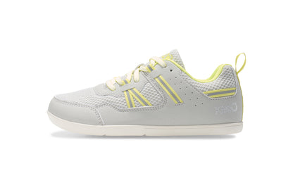 Xero Barefoot Shoes for kids sold in Ontario, Canada. These minimalist shoes have flexible soles, wide toe boxes, and zero drop. Medial side view of Xero Kid's Prio in Lunar Rock/Sunny Lime. Casual kid's sneaker.
