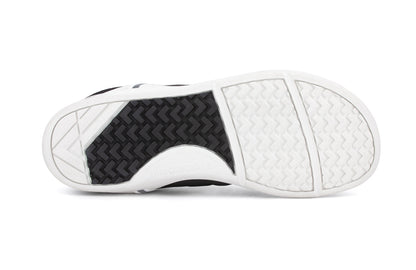 Xero Shoes Canada, specifically men’s barefoot shoes Canada. These minimalist shoes have flexible soles, wide toe boxes, and zero drop. Sole view of Xero Men's Prio in Black White. A running and fitness shoe. 
