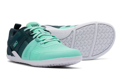 Pair of green athletic shoes with white soles on a white background.  Tru Stride Co brings Xero Shoes to Canada