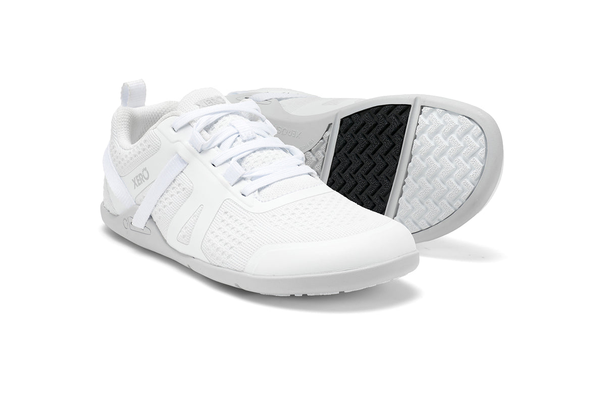 Xero Shoes Canada, specifically barefoot running shoes Canada. These minimalist shoes have flexible soles, wide toe boxes, and zero drop. Pair view of Xero Women's Prio Neo in White. Shoes made for performance and comfort. 